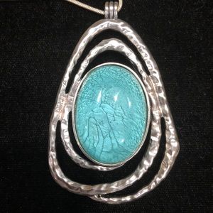 Turquoise necklace with silver chain.